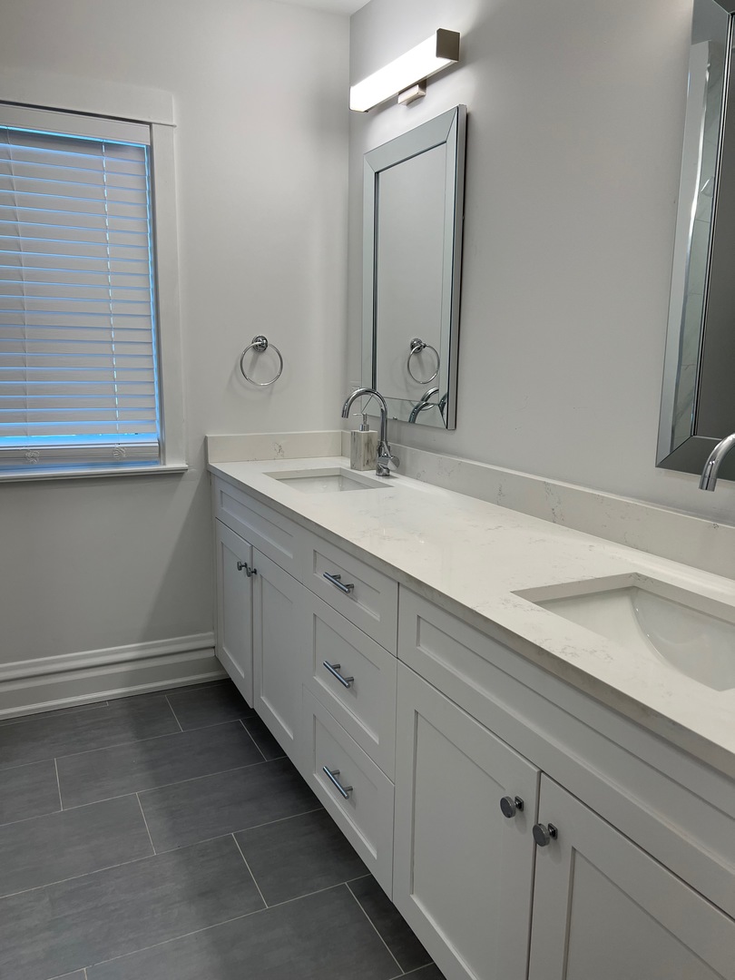 1100 Ridge Road Wilmette, IL 60091 - Photo 15 of 20 a bathroom with a sink and a mirror