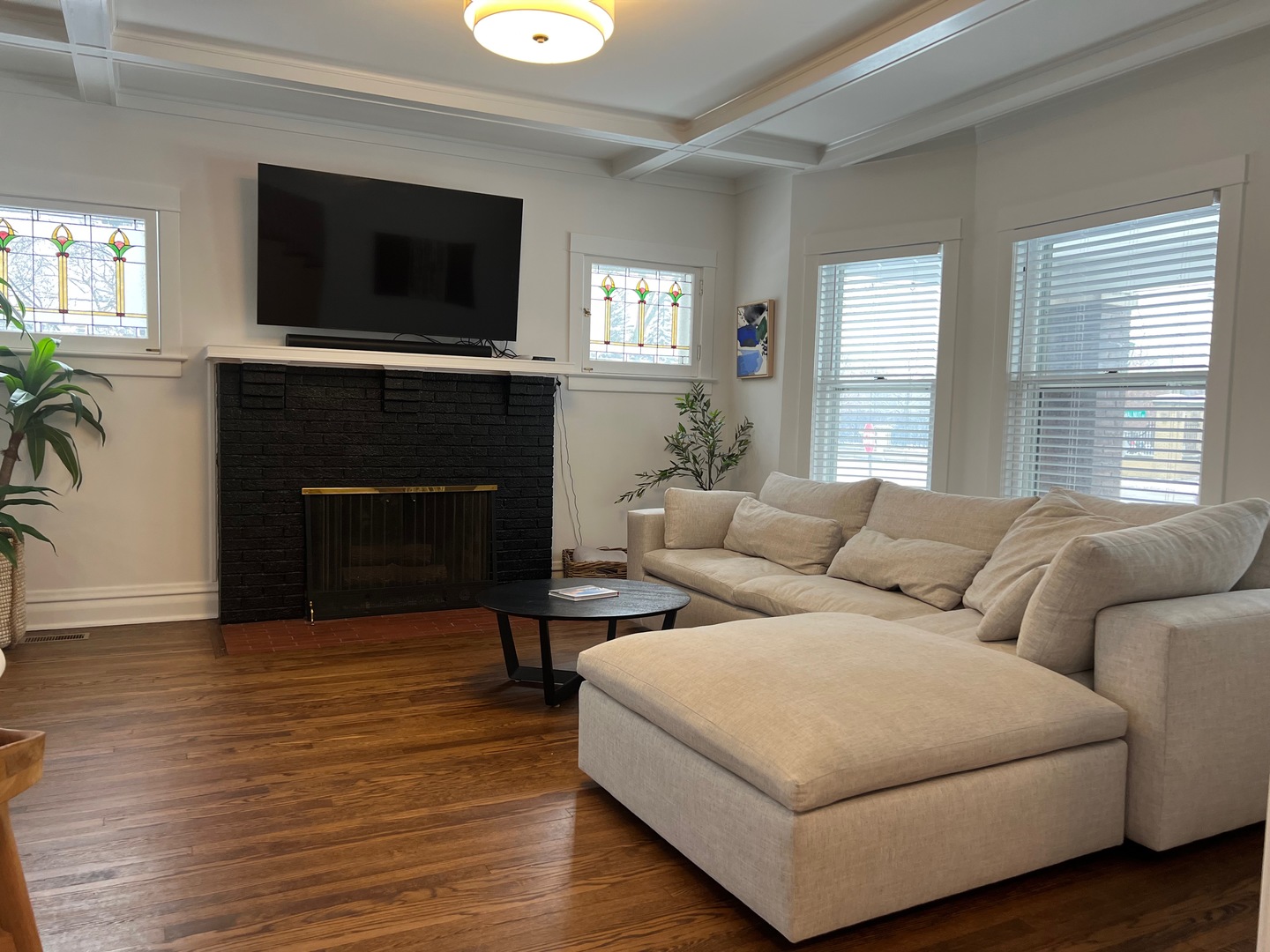 1100 Ridge Road Wilmette, IL 60091 - Photo 2 of 20 a living room with furniture a flat screen tv and a fireplace