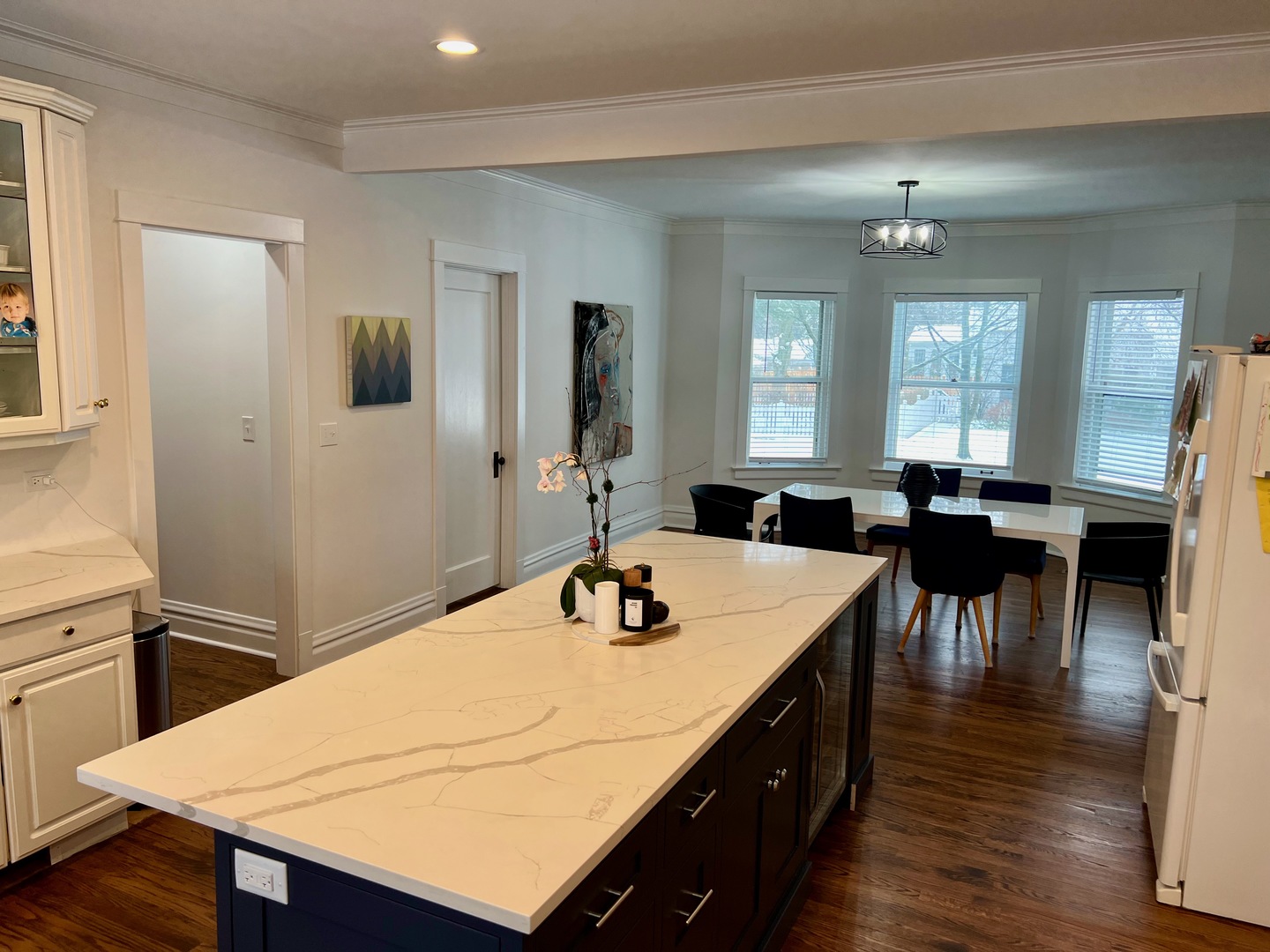 1100 Ridge Road Wilmette, IL 60091 - Photo 6 of 20 a kitchen with a table chairs and white cabinets