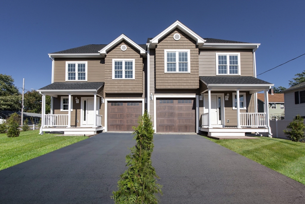 50 Pullman Avenue, Unit B Attleboro, MA 02703 - Photo 1 of 28 a front view of a house with a yard