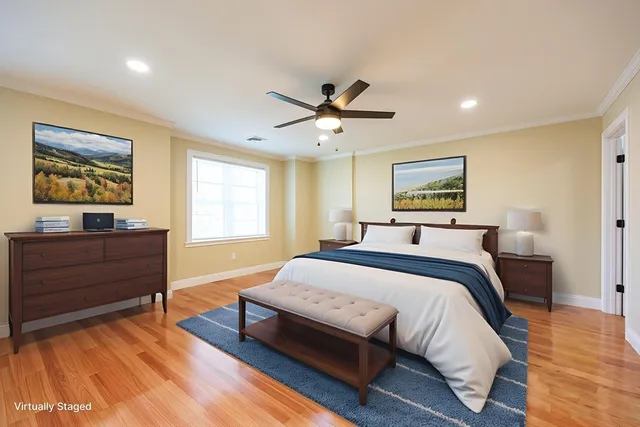 a view of an empty room and wooden floor