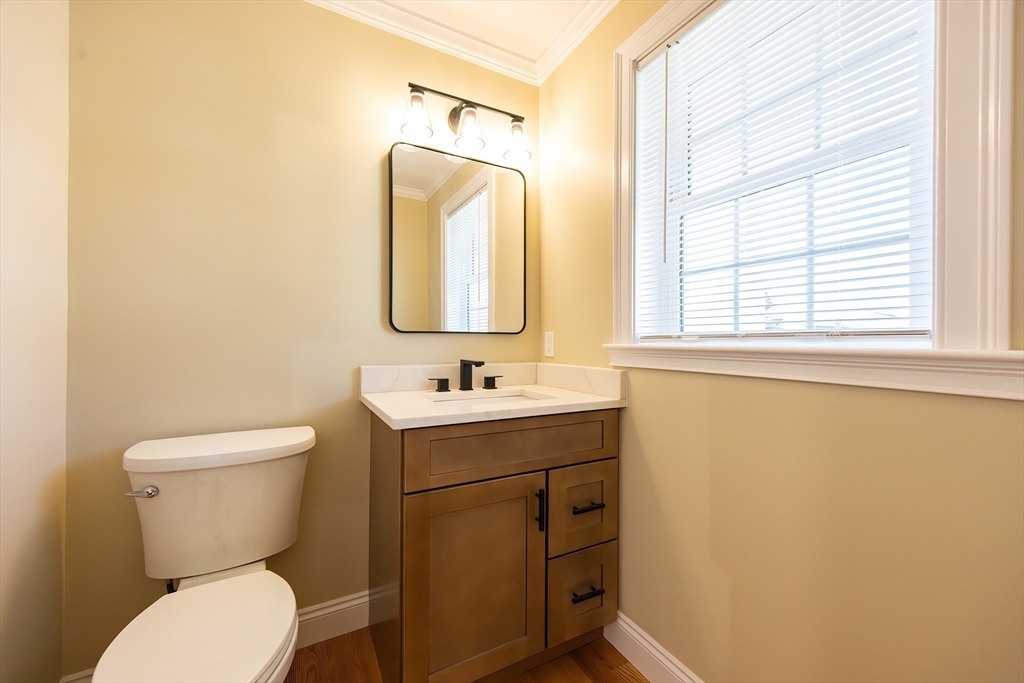 50 Pullman Avenue, Unit B Attleboro, MA 02703 - Photo 9 of 28 a bathroom with a toilet sink and mirror
