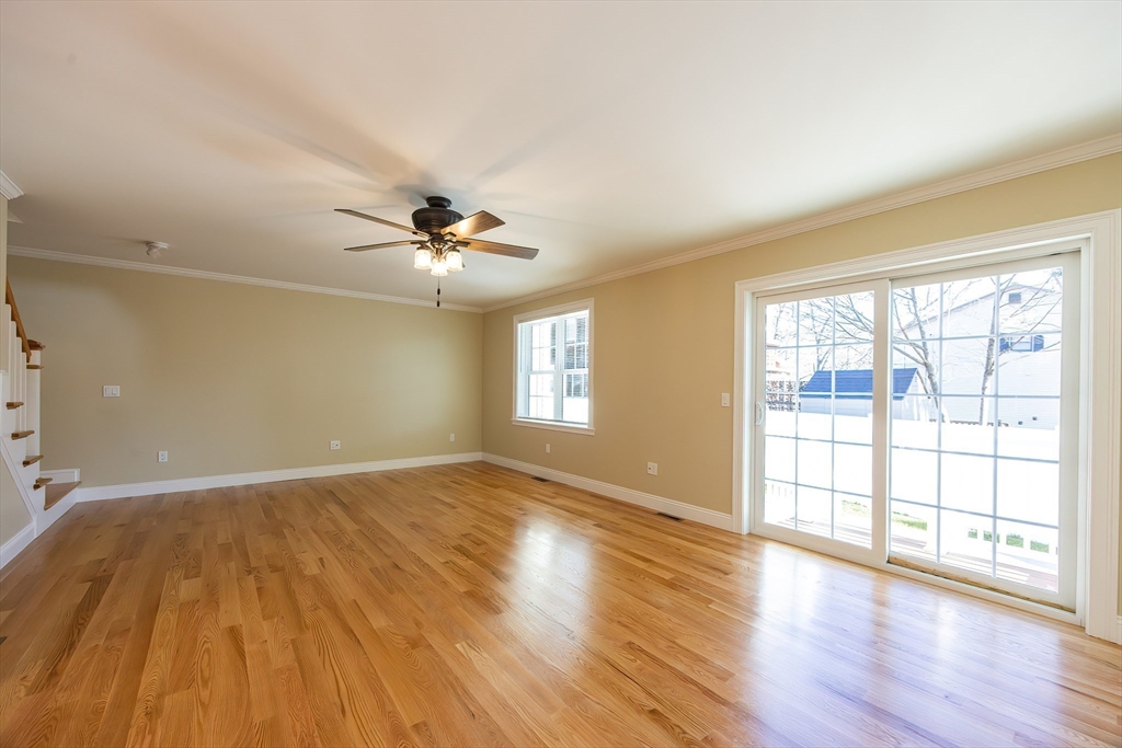 50 Pullman Avenue, Unit B Attleboro, MA 02703 - Photo 10 of 28 wooden floor in an empty room with a window