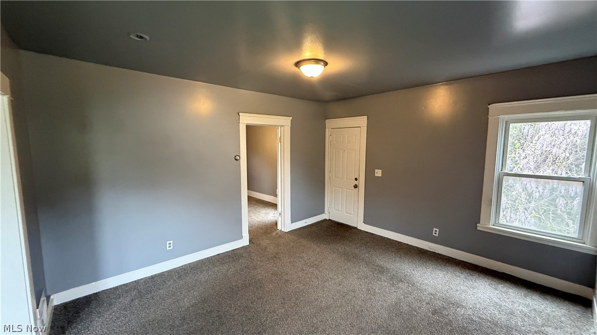 1187 Addison Road, Unit 4 Cleveland, OH 44103 - Photo 6 of 15 Carpeted interior room with gray walls and white trim