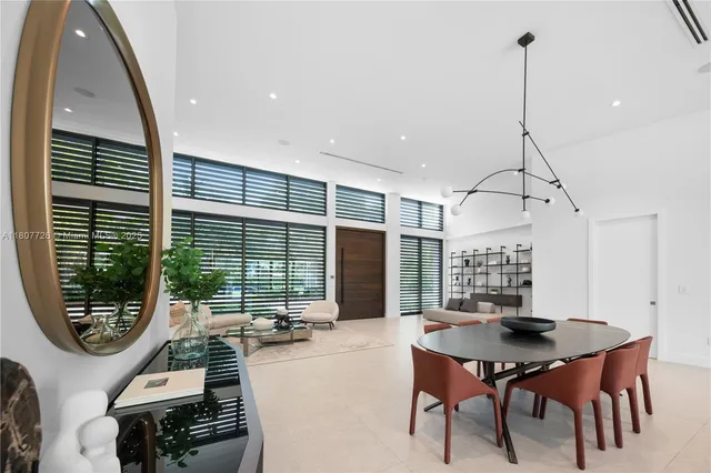 a large kitchen with a table and chairs