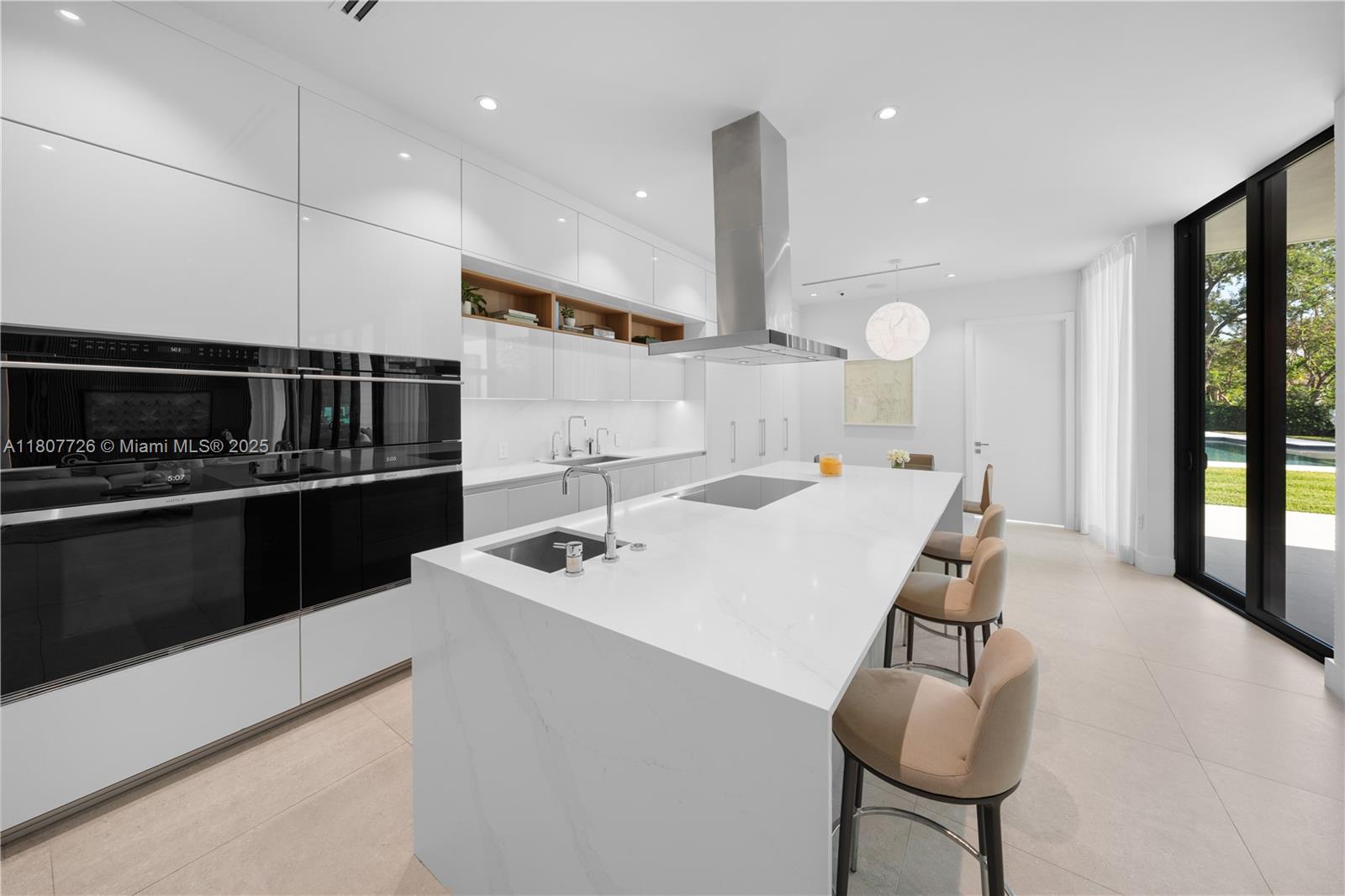 9450 Southwest 98th Street Miami, FL 33176 - Photo 25 of 66 a large kitchen with a table and chairs