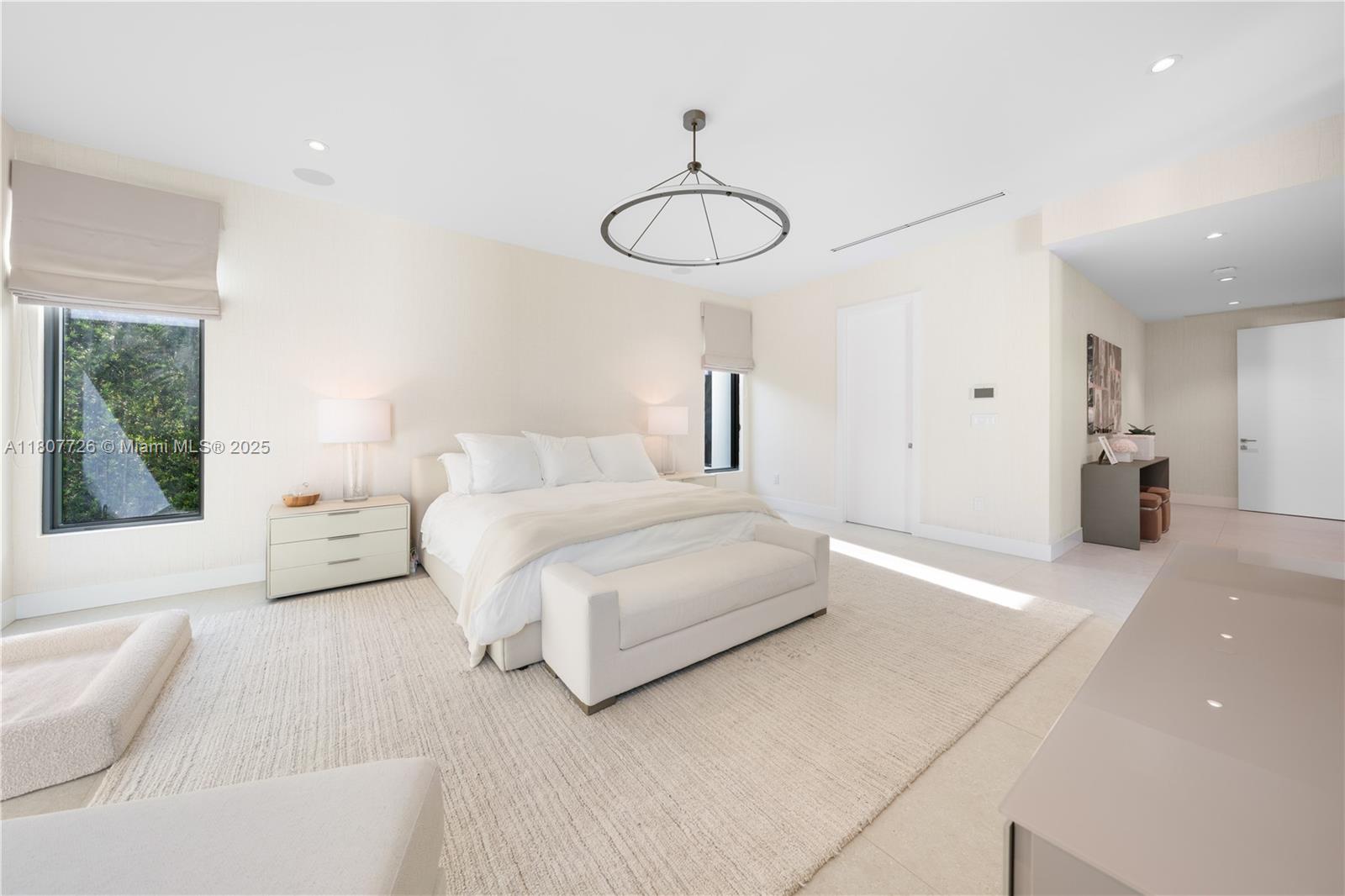 9450 Southwest 98th Street Miami, FL 33176 - Photo 37 of 66 a bedroom with a bed and a chandelier