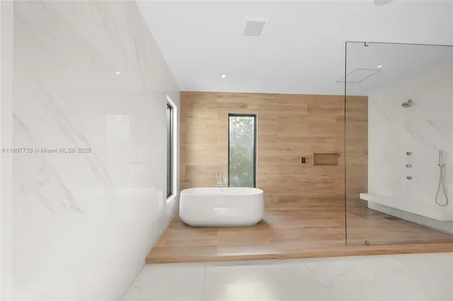 a spacious bedroom with a bed and a couch