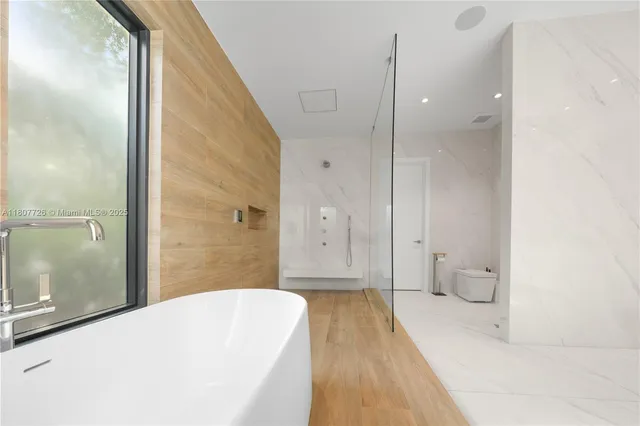 a view of a room with a floor to ceiling window