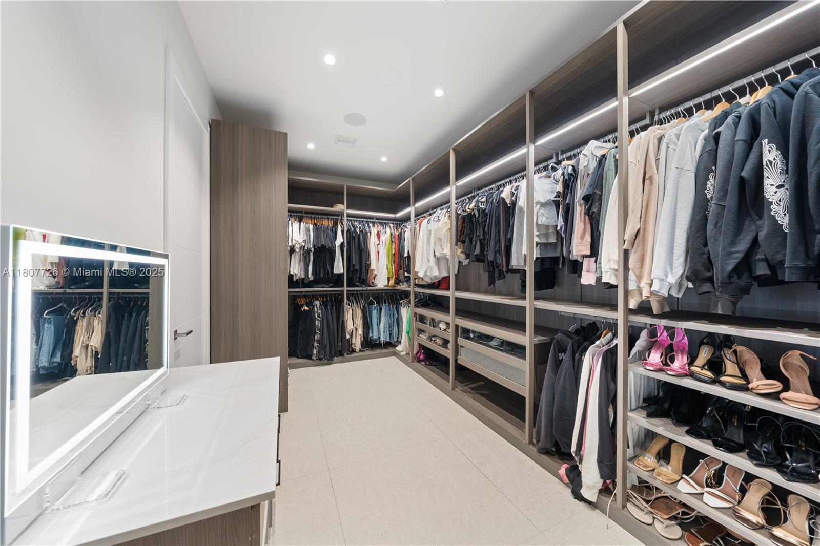 9450 Southwest 98th Street Miami, FL 33176 - Photo 44 of 66 a view of walk in closet with clothes and shoes