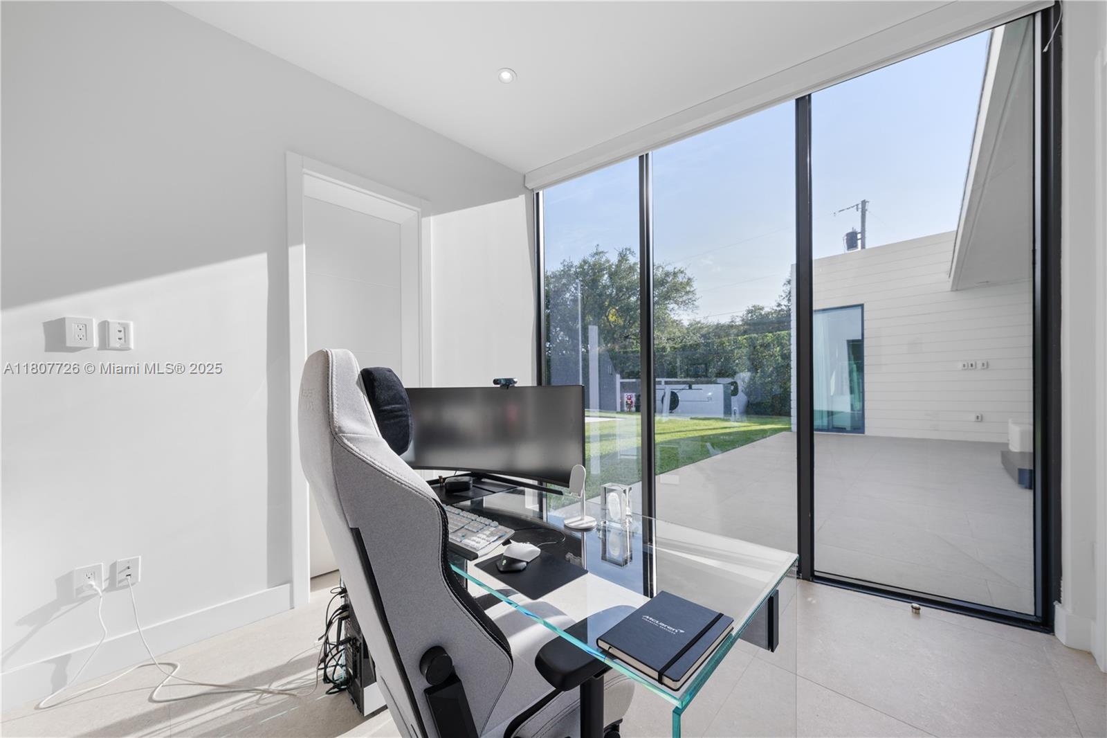 9450 Southwest 98th Street Miami, FL 33176 - Photo 47 of 66 a workspace with furniture and a gate