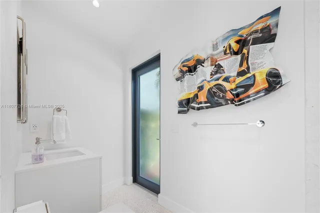 an aerial view of a house with a garden and trees