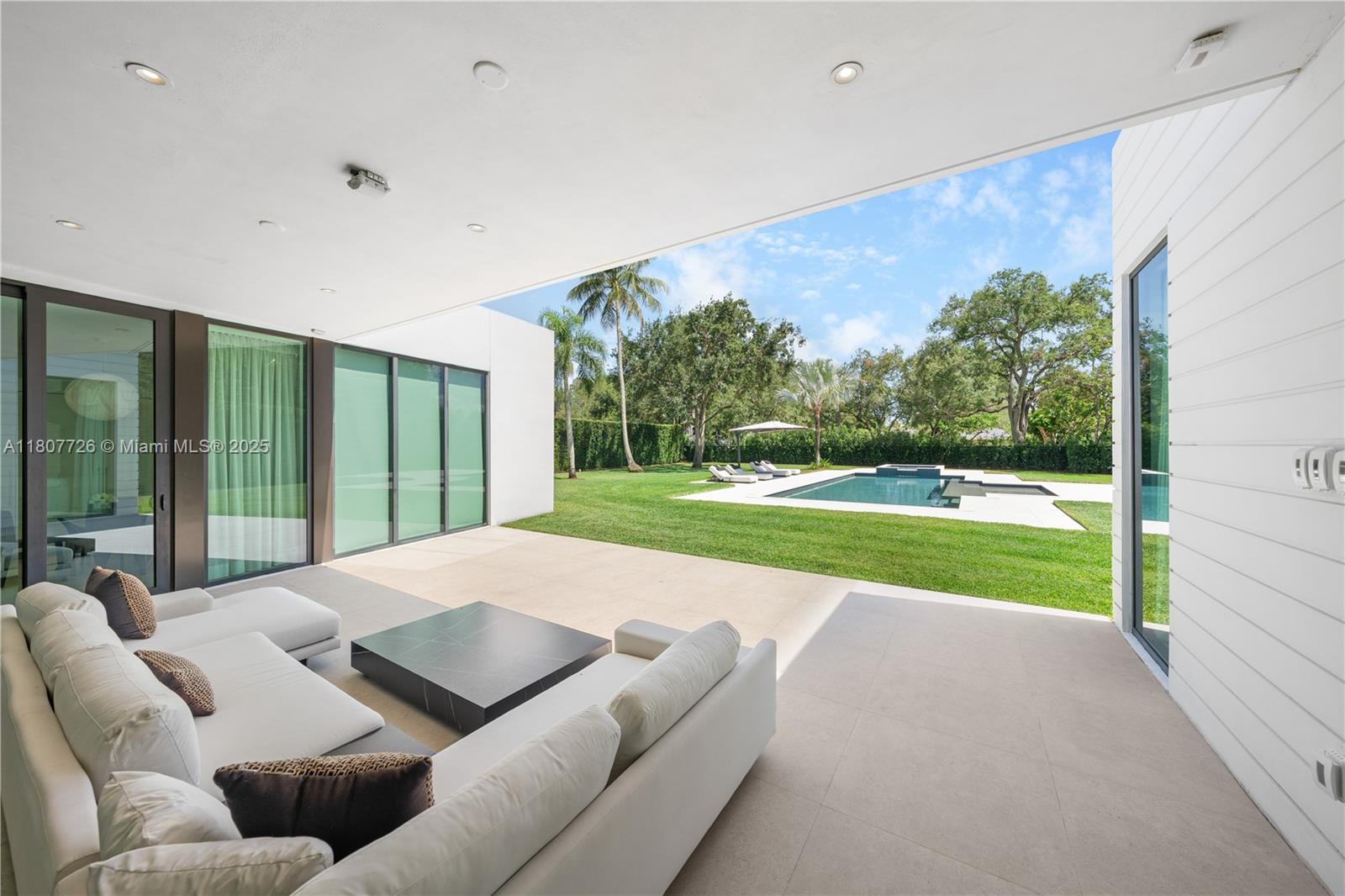 9450 Southwest 98th Street Miami, FL 33176 - Photo 60 of 66 a living room with yard and a garden