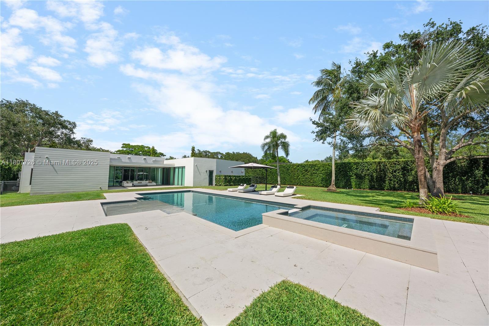 9450 Southwest 98th Street Miami, FL 33176 - Photo 63 of 66 a view of a backyard with swimming pool and seating area