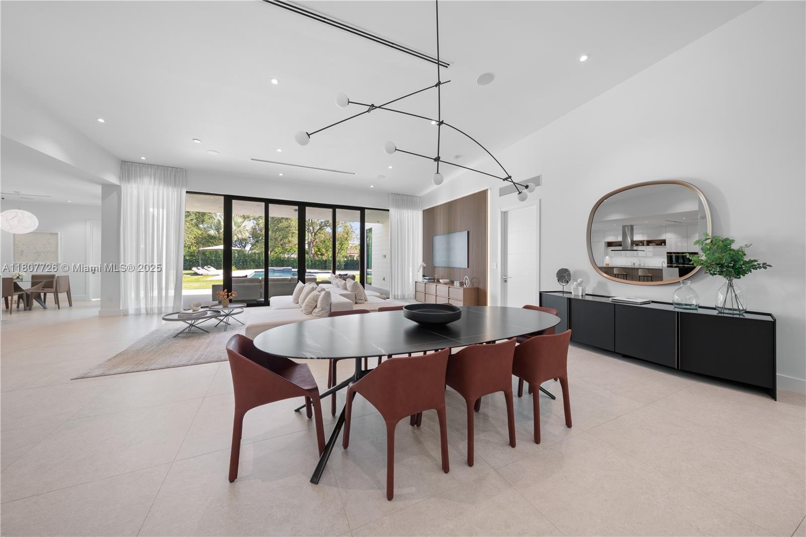 9450 Southwest 98th Street Miami, FL 33176 - Photo 9 of 66 a living room with furniture a wooden floor and chandelier