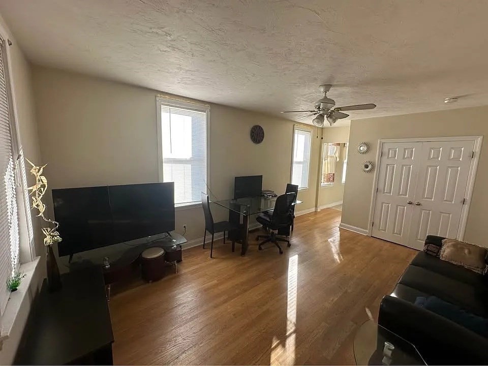 150 Sumner Street, Unit 1 Quincy, MA 02169 - Photo 7 of 10 a living room with furniture and a flat screen tv