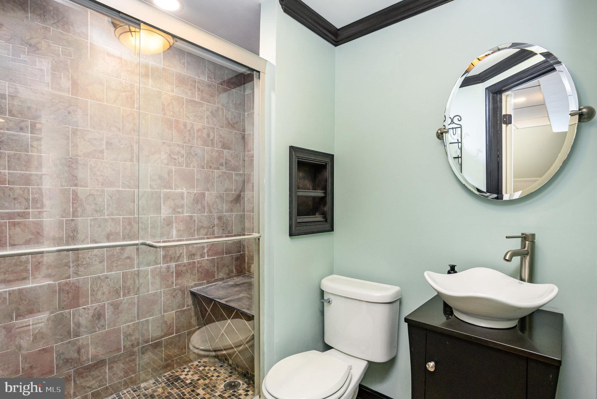 5 Kings Court Elkton, MD 21921 - Photo 18 of 34 a bathroom with a toilet a sink and mirror