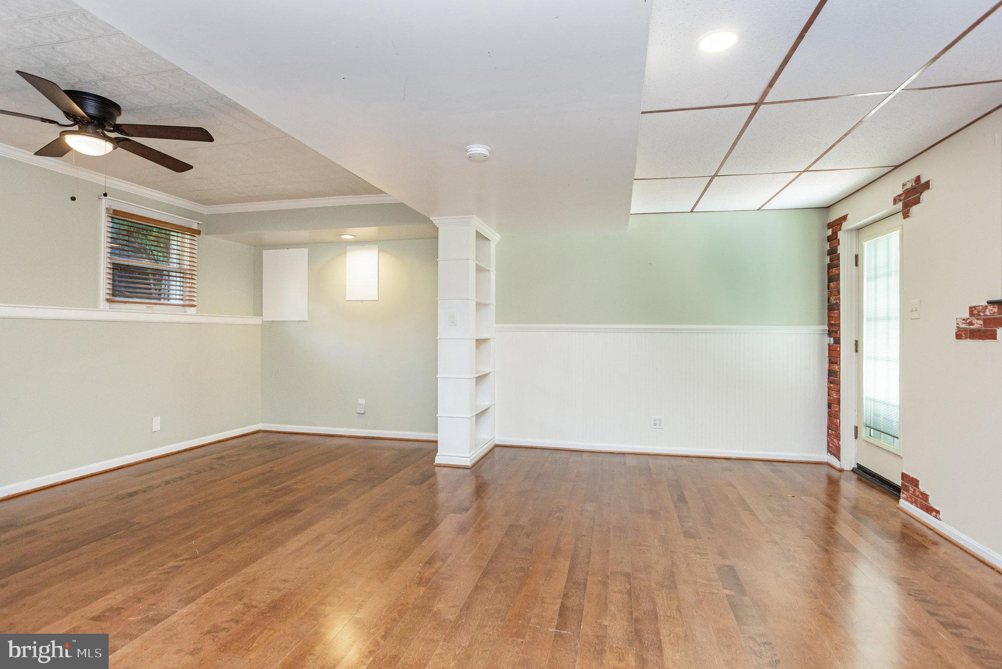 5 Kings Court Elkton, MD 21921 - Photo 22 of 34 an empty room with wooden floor and windows