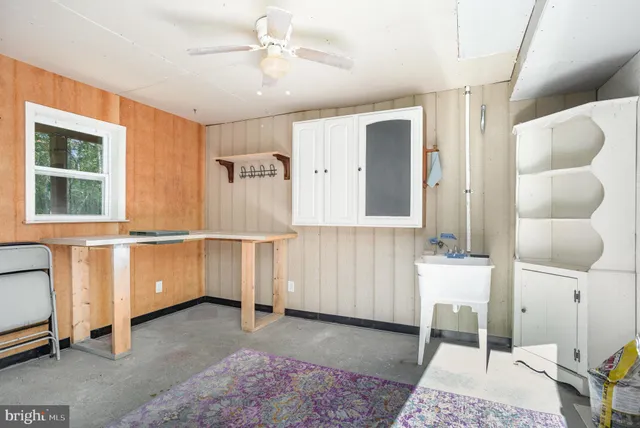 a view of a livingroom with furniture and windows