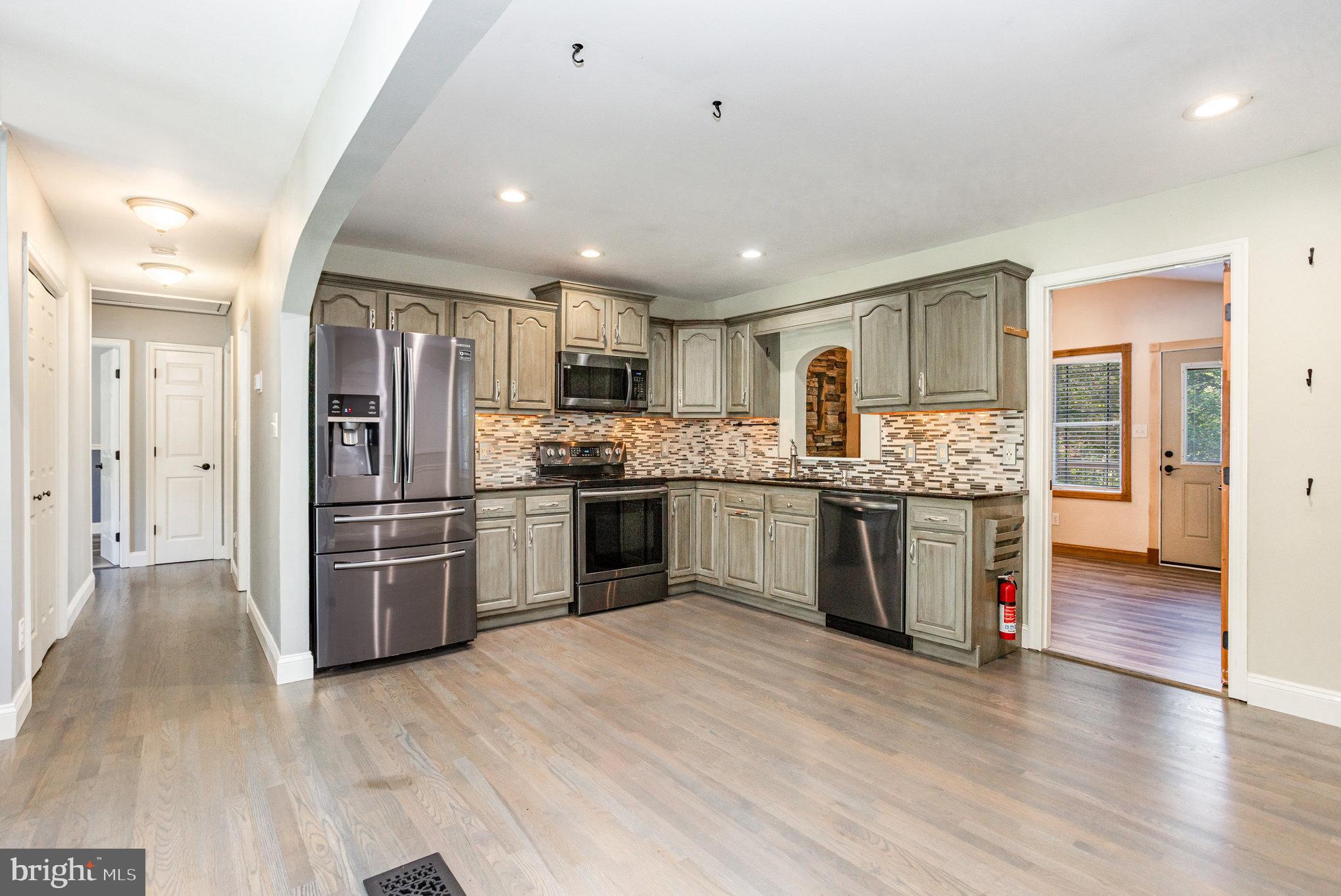 5 Kings Court Elkton, MD 21921 - Photo 2 of 34 a kitchen with stainless steel appliances kitchen island granite countertop a refrigerator and cabinets