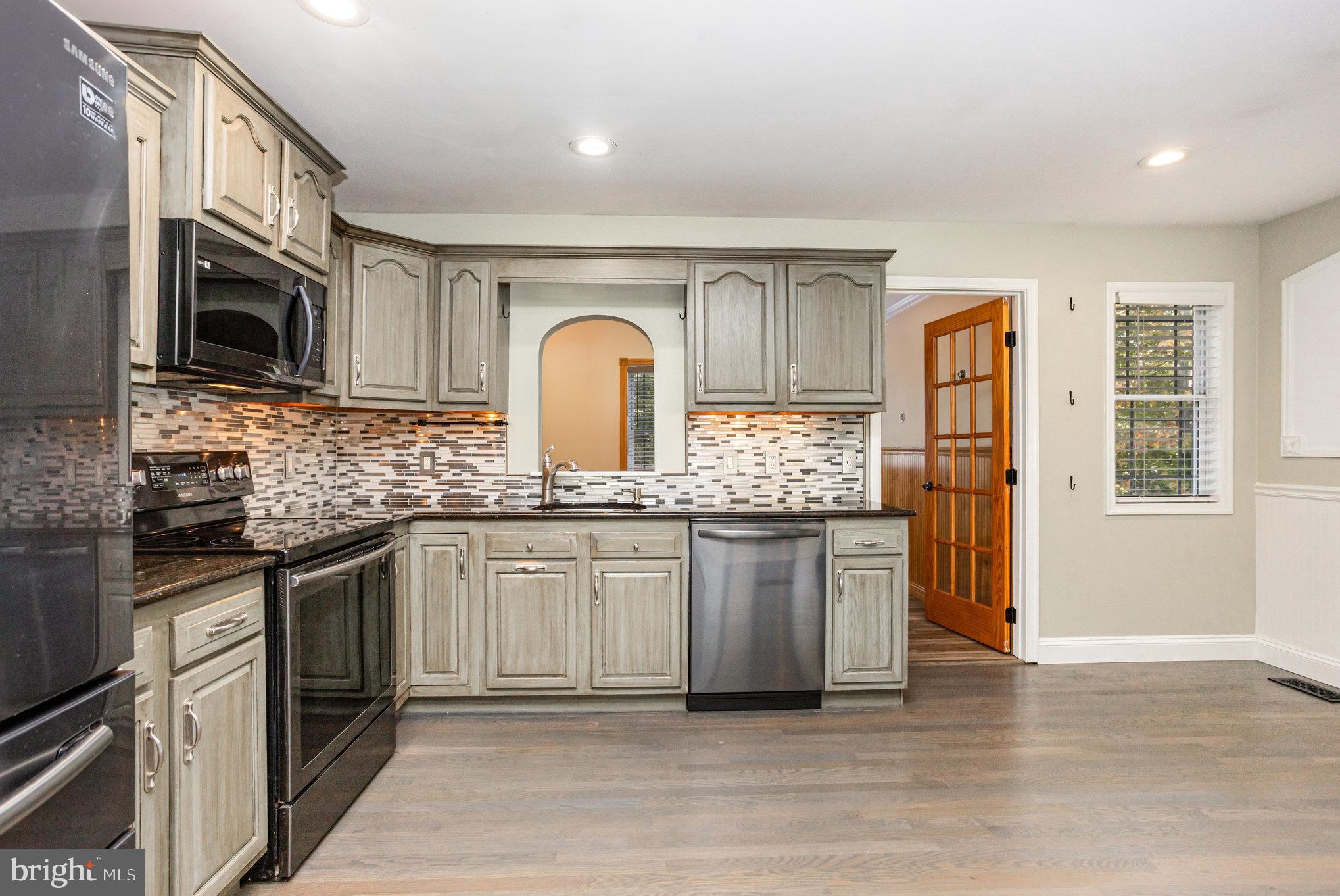 5 Kings Court Elkton, MD 21921 - Photo 4 of 34 a kitchen with stainless steel appliances granite countertop a stove a sink and a microwave