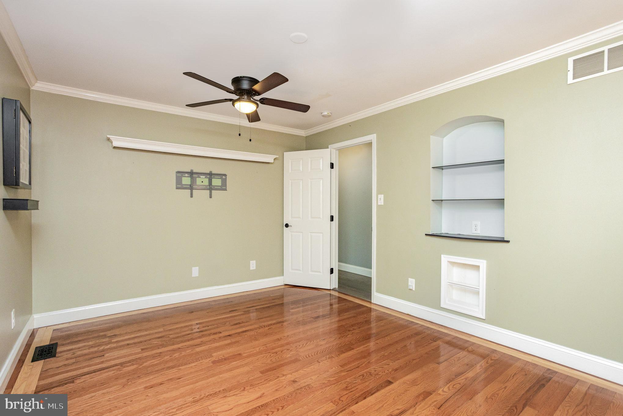 5 Kings Court Elkton, MD 21921 - Photo 9 of 34 a view of an empty room with wooden floor and a ceiling fan