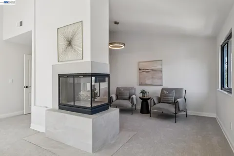 a bedroom with furniture and a mirror