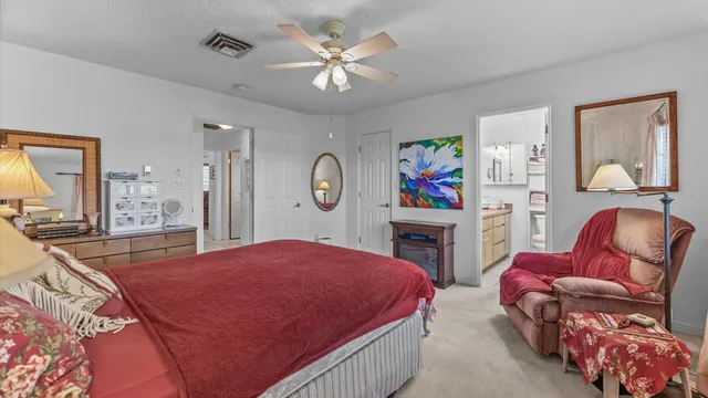 a bed room with furniture and a flat screen tv