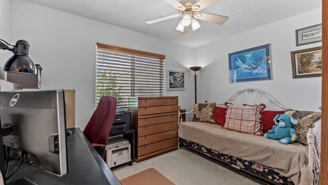 a bedroom with furniture and a window