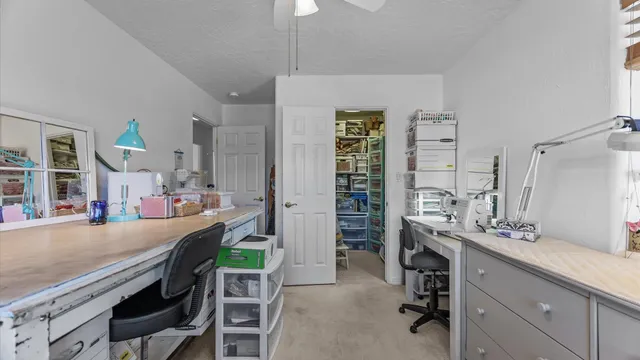 a room with a table chairs and entryway