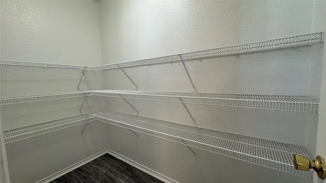 a view of an empty walk in closet