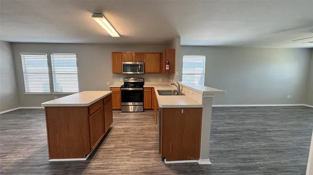 a kitchen with a stove and a sink