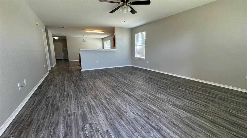 907 Post Oak Trail Anna, TX 75409 - Photo 15 of 31 wooden floor in an empty room with a window