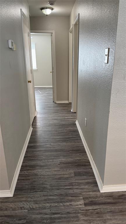 907 Post Oak Trail Anna, TX 75409 - Photo 16 of 31 a view of a hallway with wooden floor