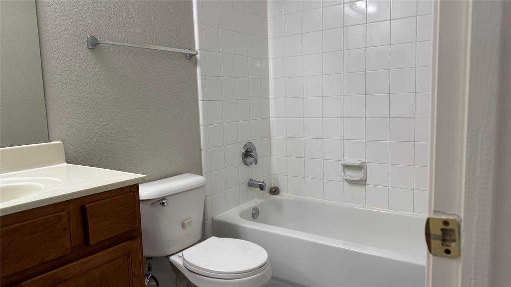 907 Post Oak Trail Anna, TX 75409 - Photo 17 of 31 a bathroom with a sink a toilet and shower