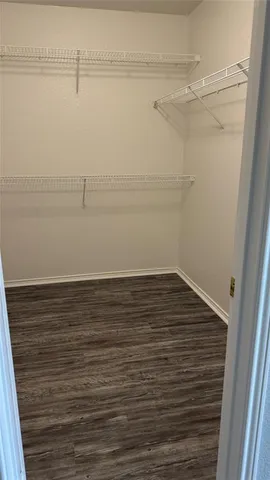 a view of a room with an empty walk in closet