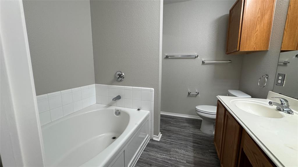 907 Post Oak Trail Anna, TX 75409 - Photo 26 of 31 a bathroom with a sink and a bathtub