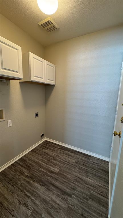907 Post Oak Trail Anna, TX 75409 - Photo 28 of 31 a view of a kitchen with wooden floor and white cabinets