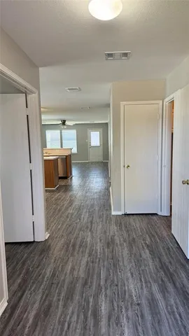 a view of a livingroom with wooden floor