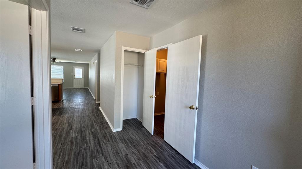 907 Post Oak Trail Anna, TX 75409 - Photo 10 of 31 a view of a hallway with wooden floor