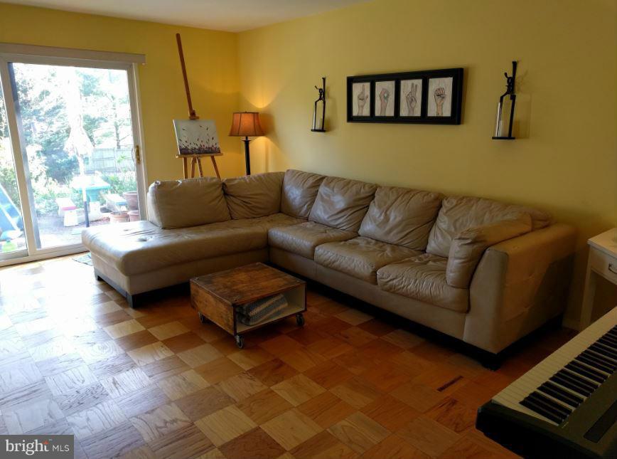 1805 Ivy Oak Square Reston, VA 20190 - Photo 2 of 8 Living room with sliding door to patio.