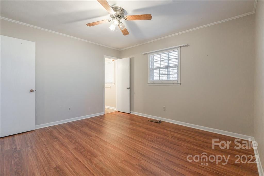 2070 John Everall Road Lancaster, SC 29720 - Photo 13 of 27 a view of an empty room with window and wooden floor