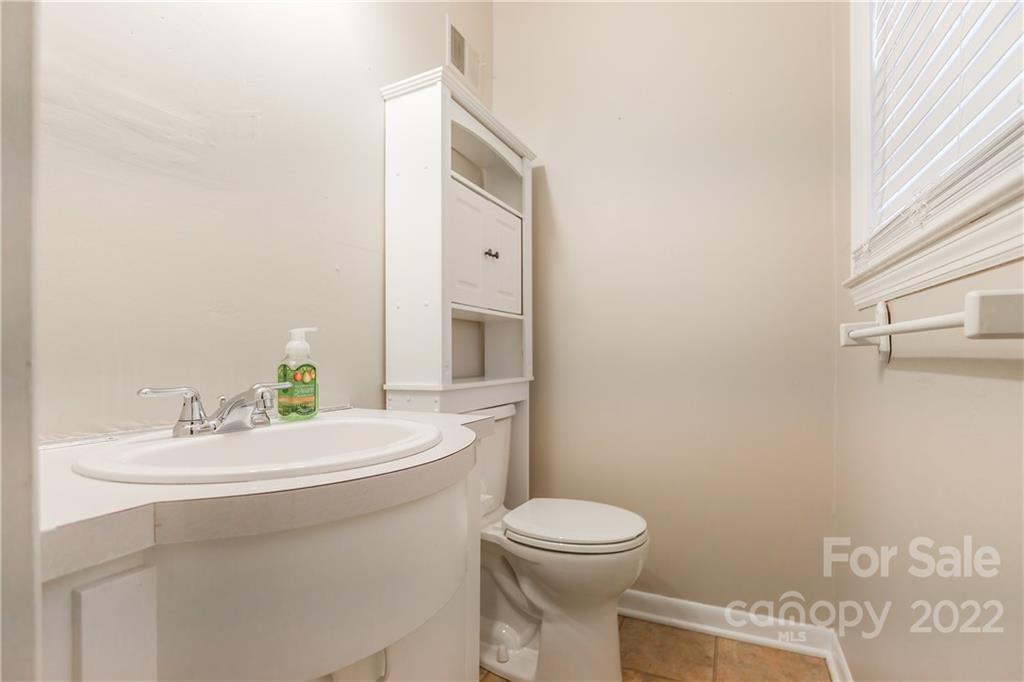 2070 John Everall Road Lancaster, SC 29720 - Photo 14 of 27 a bathroom with a sink a toilet and mirror