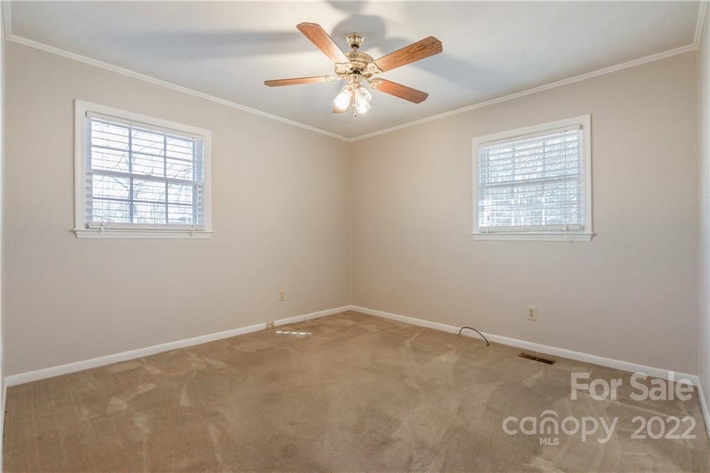 2070 John Everall Road Lancaster, SC 29720 - Photo 19 of 27 an empty room with windows and fan
