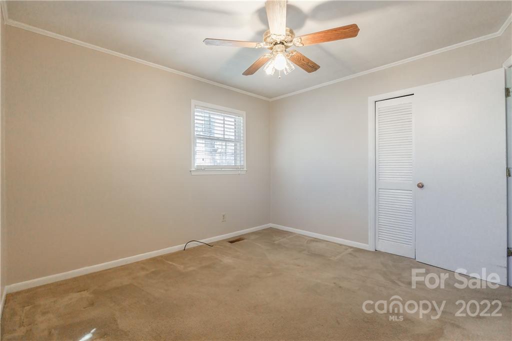 2070 John Everall Road Lancaster, SC 29720 - Photo 20 of 27 an empty room with windows and fan