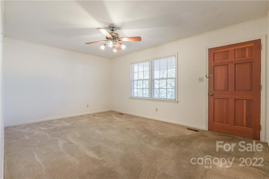 2070 John Everall Road Lancaster, SC 29720 - Photo 3 of 27 an empty room with windows and fan