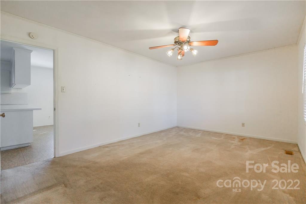 2070 John Everall Road Lancaster, SC 29720 - Photo 4 of 27 an empty room with a window and ceiling fan