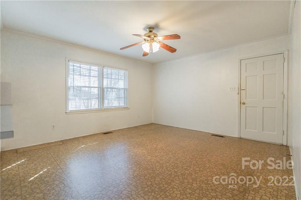 2070 John Everall Road Lancaster, SC 29720 - Photo 5 of 27 an empty room with windows and fan