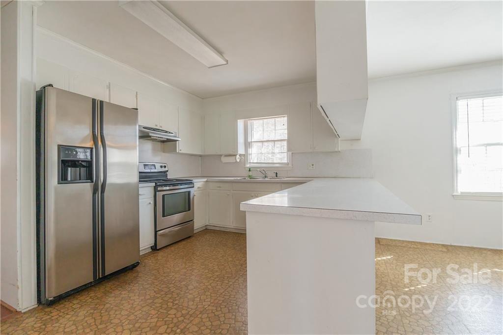 2070 John Everall Road Lancaster, SC 29720 - Photo 7 of 27 a kitchen with a refrigerator sink and cabinets