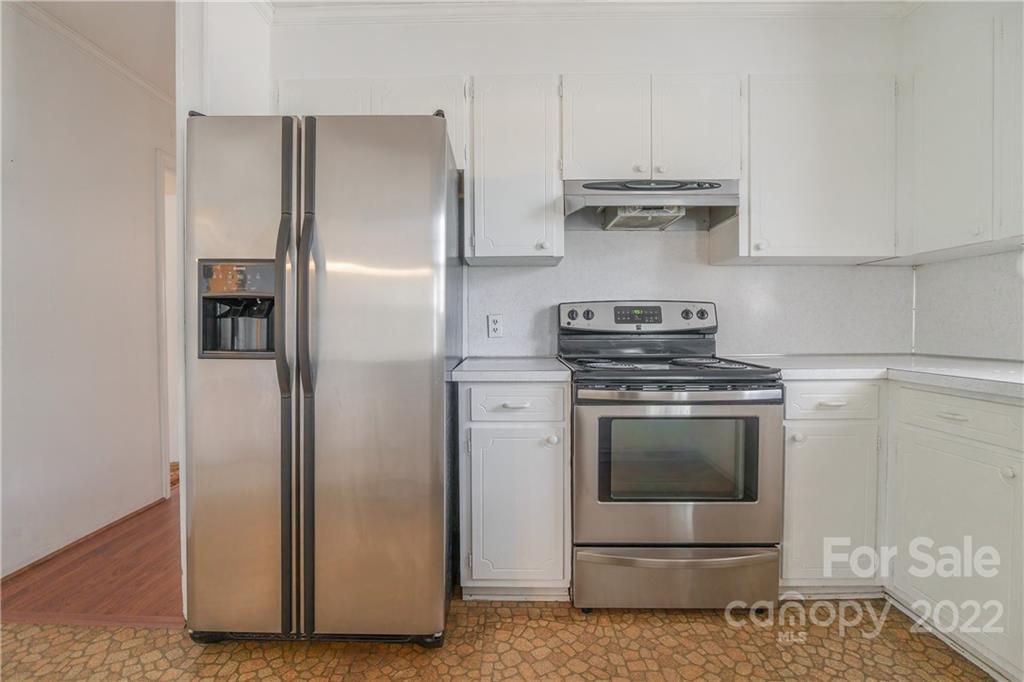 2070 John Everall Road Lancaster, SC 29720 - Photo 8 of 27 a kitchen with stainless steel appliances granite countertop a refrigerator and a stove